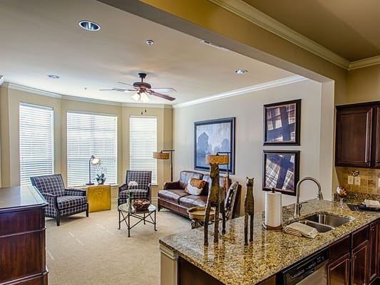 Living room featuring seating area and open kitchen at The Westmore