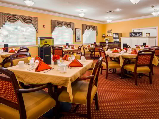 Well-decorated dining room with tables set for meals