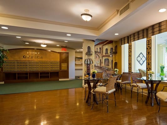 Interior view of the post office area with mailboxes and seating