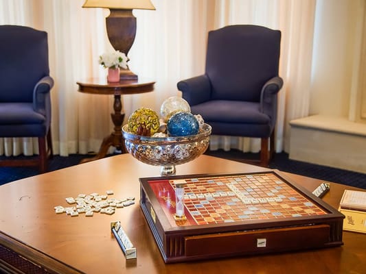 Scrabble board and decorative bowl in a cozy game area