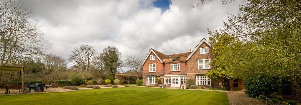 View of the garden and exterior of Tithe Farm building