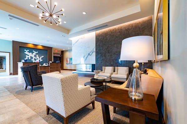 Spacious and stylish lobby with seating areas and reception desk
