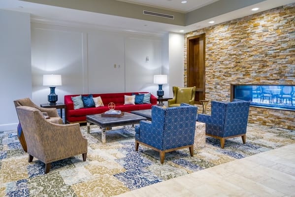 Interior view of a living room with blue and red seating