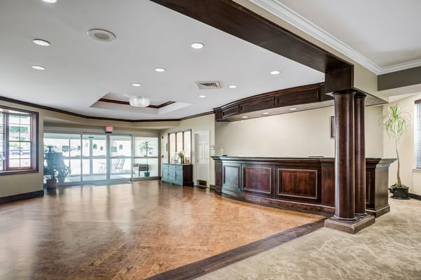 Spacious lobby with check-in desk and seating area