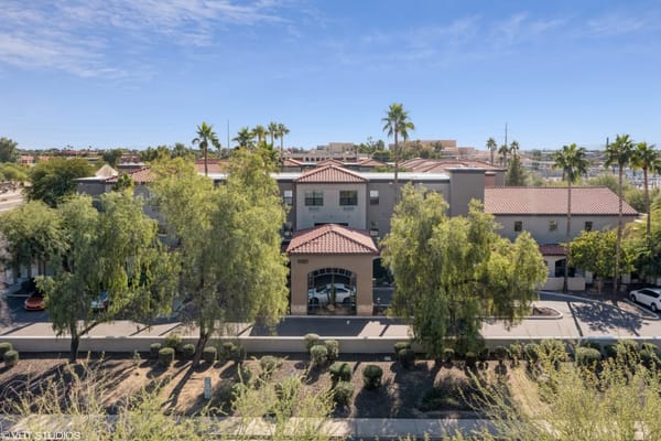 Aerial view of the exterior of Truewood by Merrill in Scottsdale, AZ, showcasing the building and surrounding landscape.
