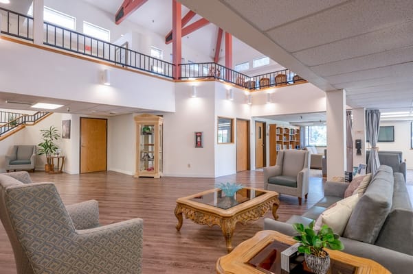 Spacious lobby with seating areas and a decorative table