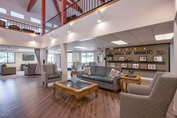 Lobby area featuring a 'Wall of Honor' and comfortable seating.
