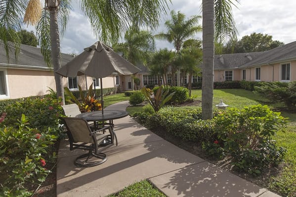 Pathway with seating area in a landscaped garden