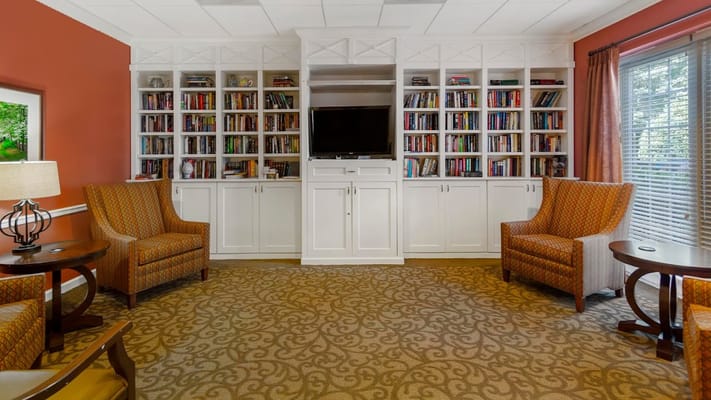 Cozy common area with bookshelves and seating