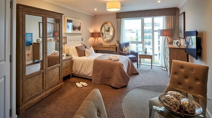 A well-furnished private resident room with natural light