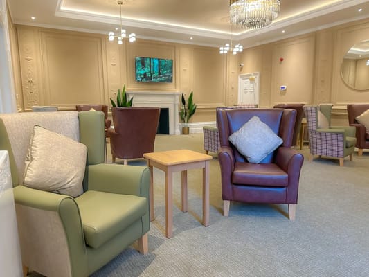 Cozy common area with seating and a TV