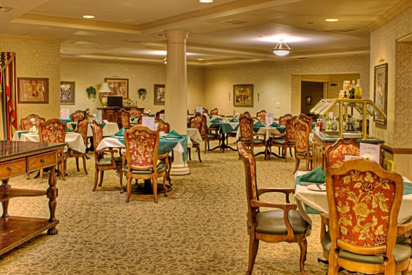 Dining area with ornate chairs and tables