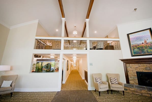 Lobby area with seating and a hallway