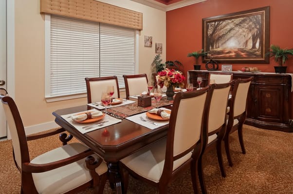 Dining room with a wooden table set for a meal