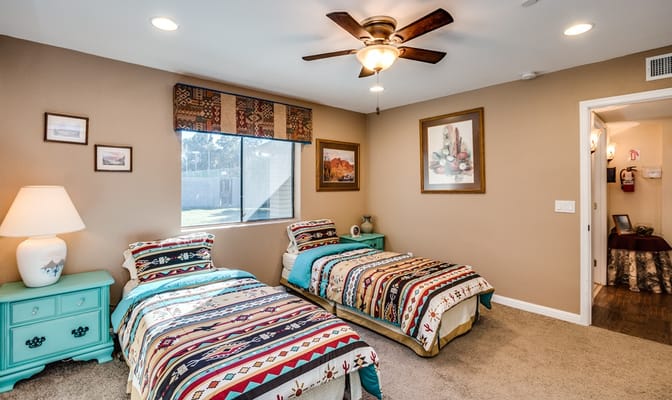 Cozy shared bedroom with two beds and decor