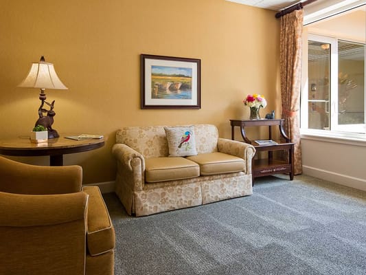 Comfortable living room setup with a couch and decorative items.