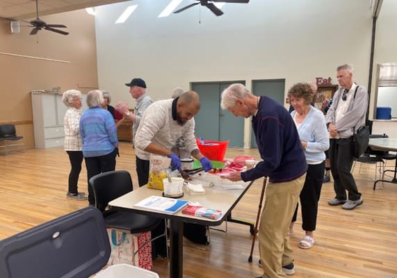 Residents and staff participating in an activity indoors
