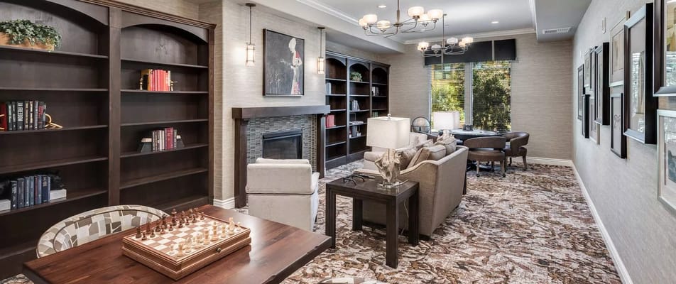 Interior common area with bookshelves and seating