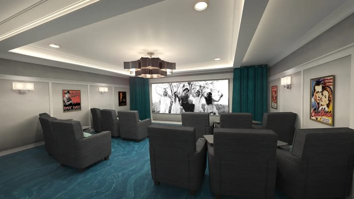 Interior theater room with comfortable seating and a movie screen