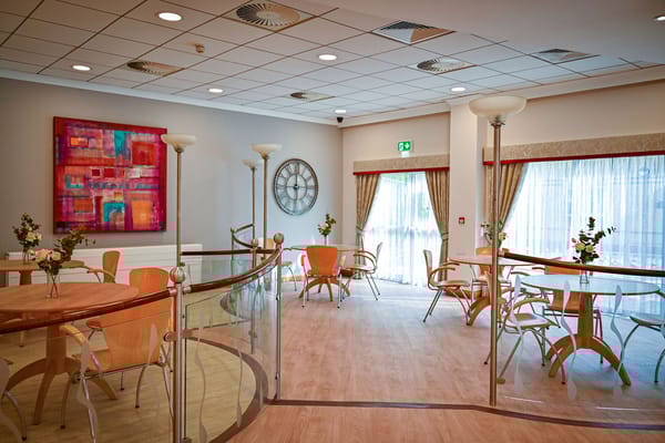 Interior common area with wooden tables and chairs