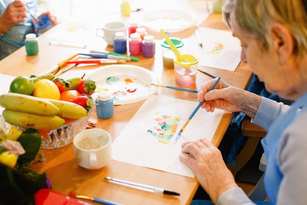 Residents engaging in a creative painting activity.
