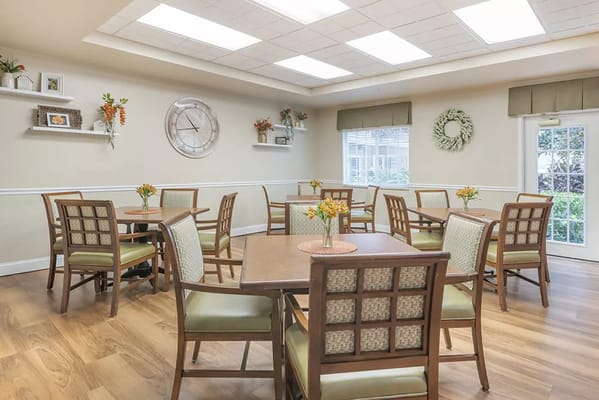 Bright common area with tables and chairs