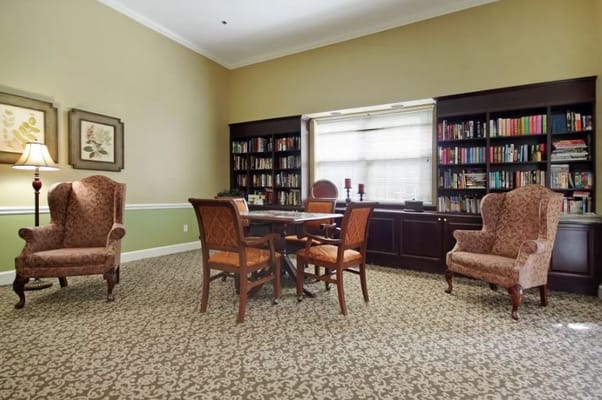 Cozy common area with bookshelves and seating