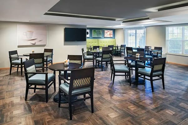 Interior view of a dining area with tables and chairs