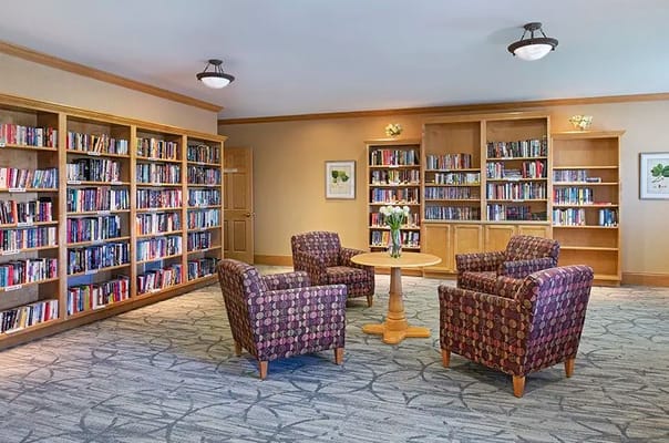 Cozy library area with bookshelves and seating