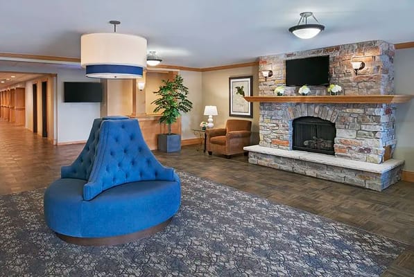 Interior view of a cozy lounge area with a fireplace