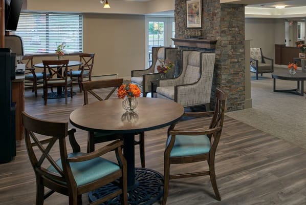 Bright common area with seating and flowers