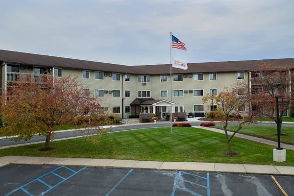Exterior view of American House Grand Blanc with American flag