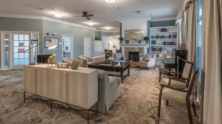 Bright common area with seating and bookshelves