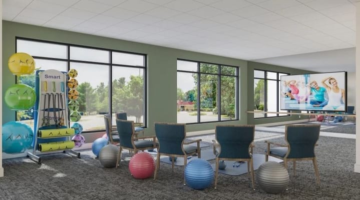 Interior of a fitness area with exercise balls and equipment
