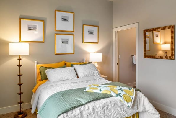 Cozy bedroom with decorative wall art and bedding