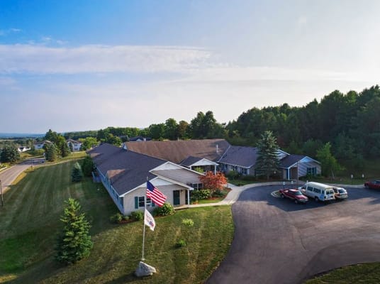 Aerial view of the facility with outdoor space and building