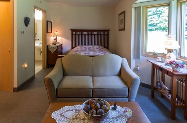 Cozy resident room with a sofa and decorative touches