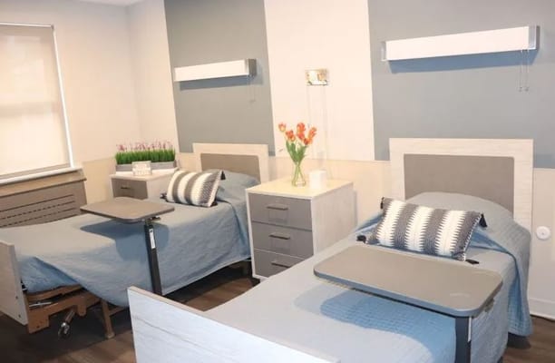 Interior view of a shared resident room with beds