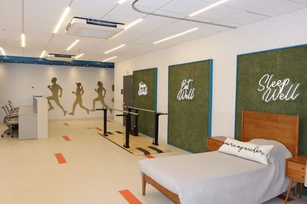 Spacious interior rehabilitation room with motivational wall art