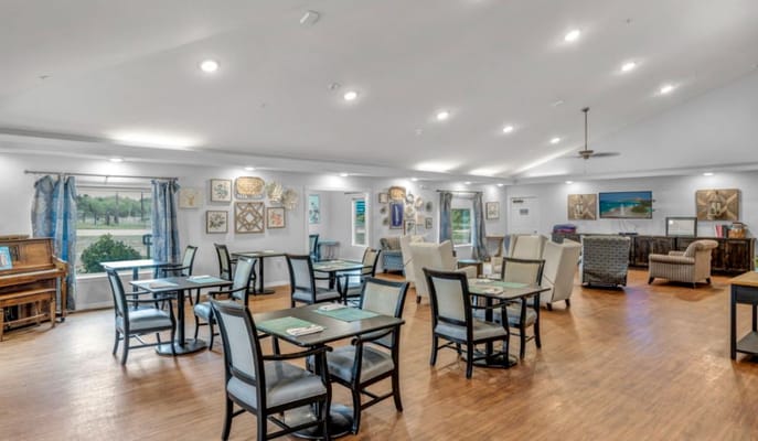 Bright common area with seating and art displays