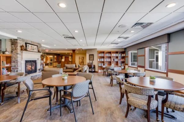 Bright common area with seating and bookshelves