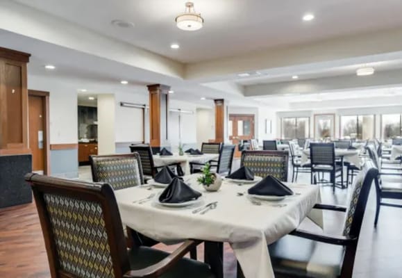 Well-set dining room with elegant tables and chairs