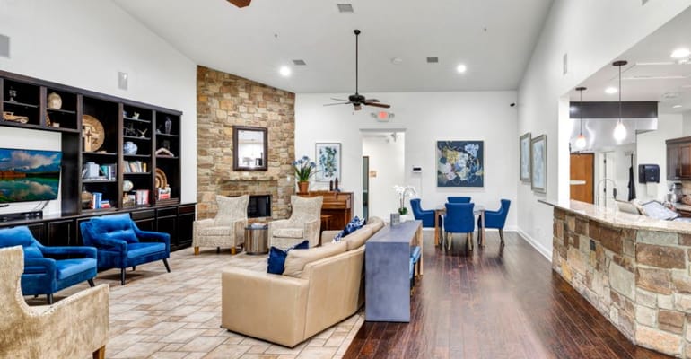 Common area with comfortable seating and a warm atmosphere