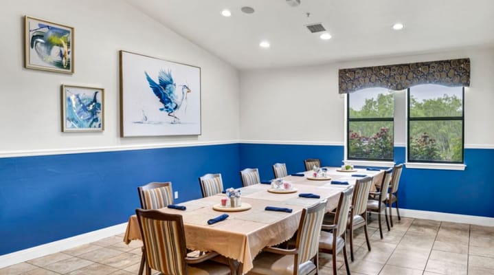 Bright dining room with tables set for a meal