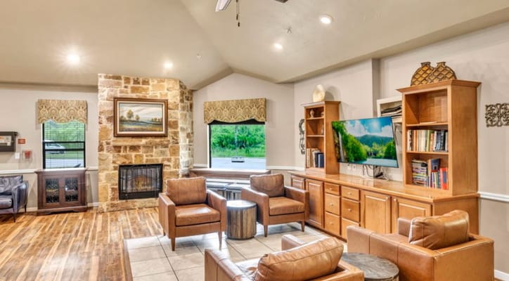 Comfortable common area with seating and a fireplace