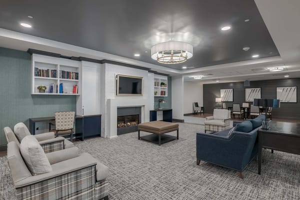 Interior common area with cozy seating and fireplace