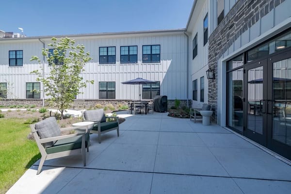 Outdoor seating area with tables and chairs