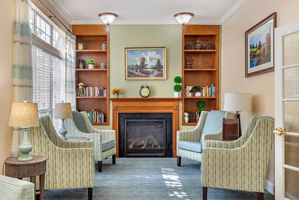 Cozy common area with comfortable seating and bookshelves