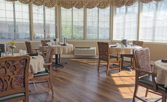 Bright dining room with tables and chairs