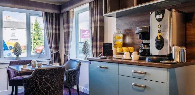 Coffee station with refreshments in cozy dining area